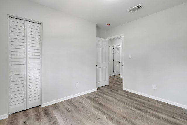 2314 Oxford Rd, Tallahassee, FL 32304 - unfurnished bedroom featuring wood finished floors and baseboards