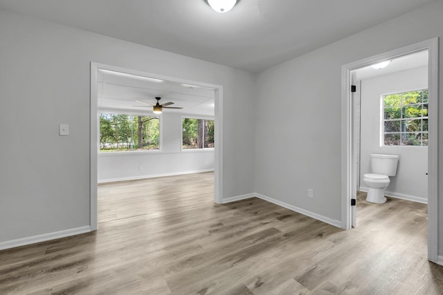 2314 Oxford Rd, Tallahassee, FL 32304 - empty room with plenty of natural light, wood finished floors, a ceiling fan, and baseboards