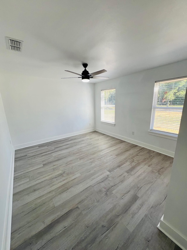 unfurnished room featuring ceiling fan and light hardwood / wood-style flooring