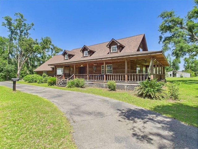 3696 Joel Aman Rd, Perry, FL 32347 - view of front of property with covered porch and a front lawn