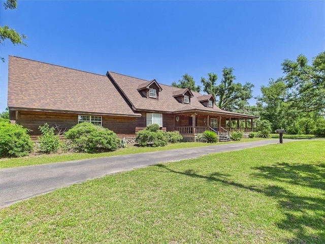 3696 Joel Aman Rd, Perry, FL 32347 - view of front facade with covered porch, a front lawn, and asphalt driveway