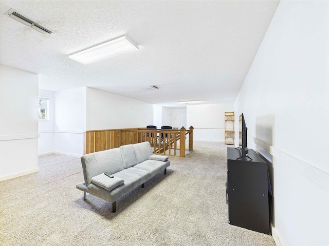 3696 Joel Aman Rd, Perry, FL 32347 - living area featuring carpet, a textured ceiling, and an upstairs landing