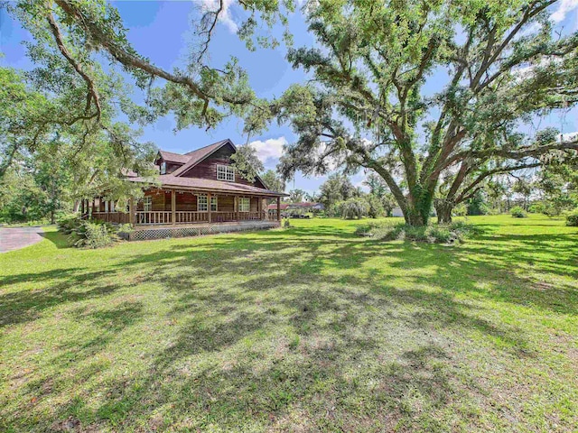 3696 Joel Aman Rd, Perry, FL 32347 - view of green lawn featuring a porch