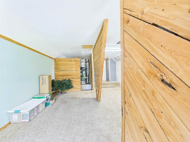 3696 Joel Aman Rd, Perry, FL 32347 - corridor with carpet flooring, wooden walls, and heating unit