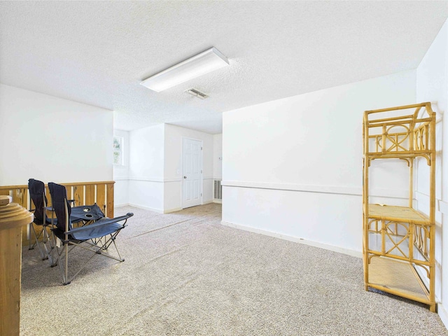 3696 Joel Aman Rd, Perry, FL 32347 - sitting room featuring carpet flooring, a textured ceiling, and baseboards