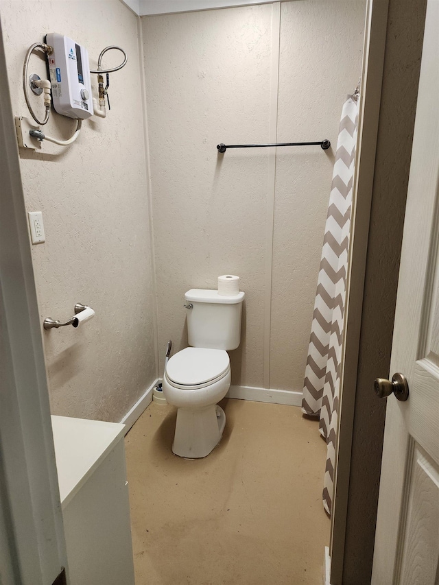 bathroom featuring toilet and concrete flooring