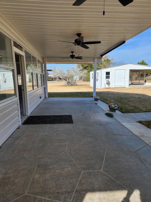 view of patio / terrace with an outdoor structure and ceiling fan