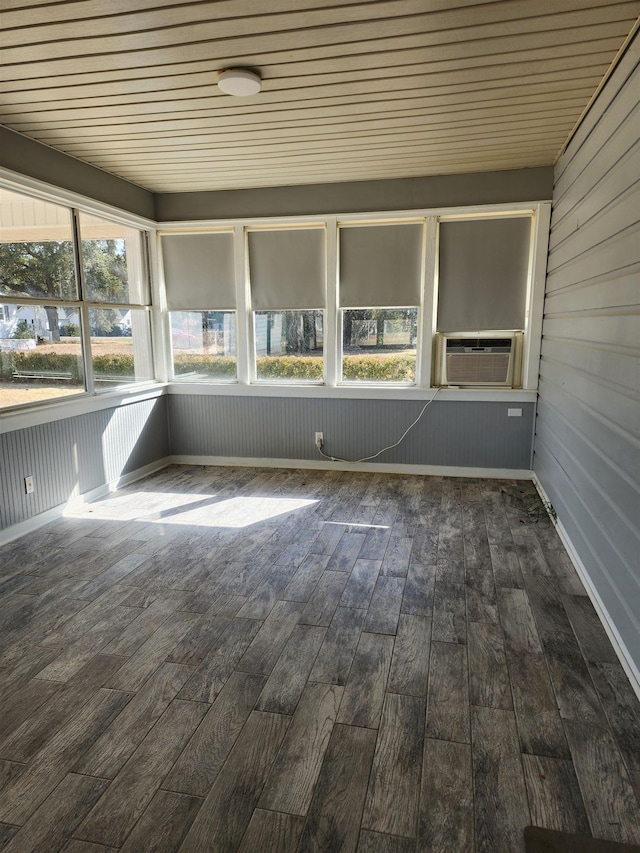 unfurnished sunroom featuring a healthy amount of sunlight and cooling unit