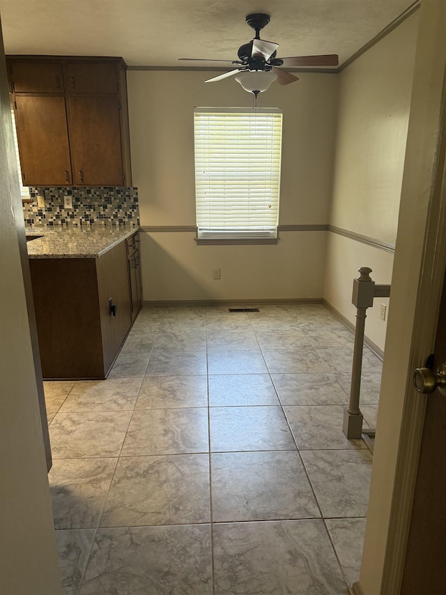 3726 Wicklow Cir, Tallahassee, FL 32309 - unfurnished dining area featuring a ceiling fan and ornamental molding