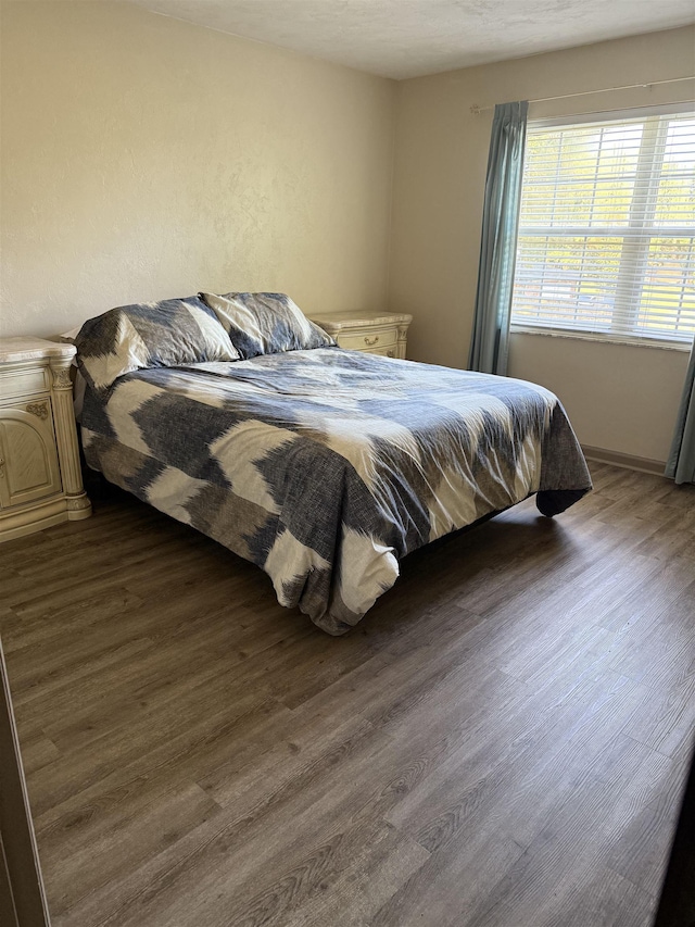 3726 Wicklow Cir, Tallahassee, FL 32309 - bedroom with dark wood-style floors and baseboards