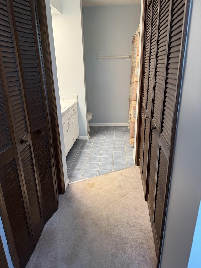 3726 Wicklow Cir, Tallahassee, FL 32309 - bathroom featuring a closet, vanity, and tile patterned flooring