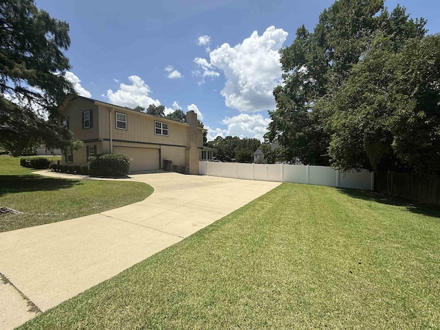 3726 Wicklow Cir, Tallahassee, FL 32309 - view of yard featuring an attached garage and concrete driveway