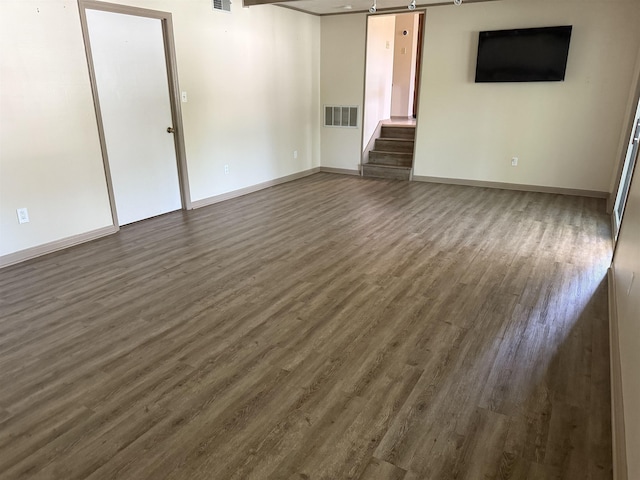 3726 Wicklow Cir, Tallahassee, FL 32309 - unfurnished room with dark wood-style floors and stairs