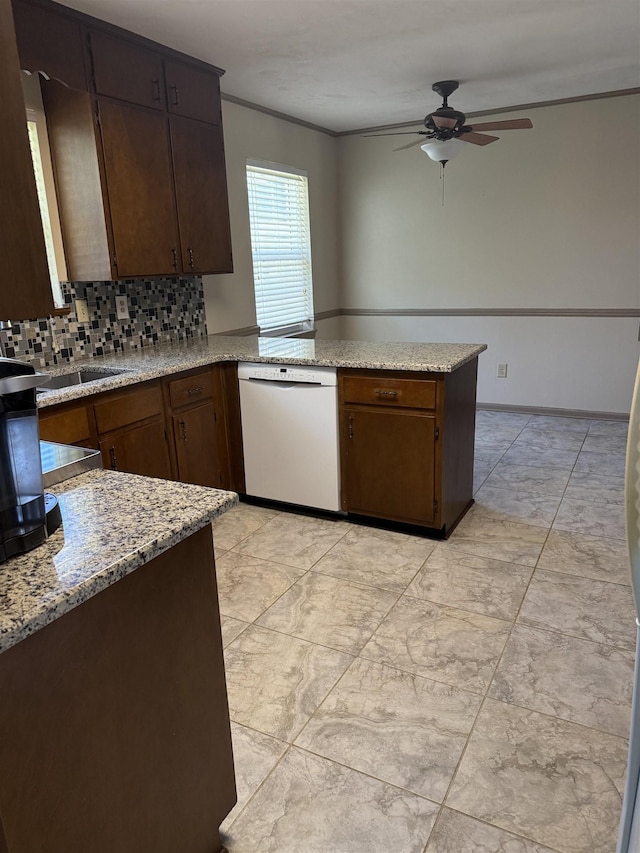 3726 Wicklow Cir, Tallahassee, FL 32309 - kitchen with ceiling fan, white dishwasher, decorative backsplash, ornamental molding, and a peninsula