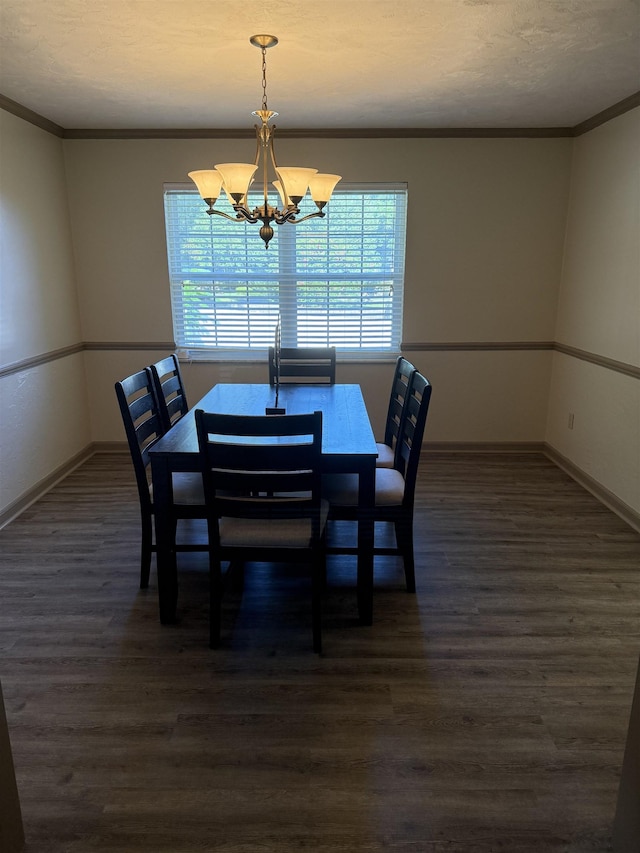 3726 Wicklow Cir, Tallahassee, FL 32309 - dining room with dark wood-style flooring, a chandelier, crown molding, and a textured ceiling