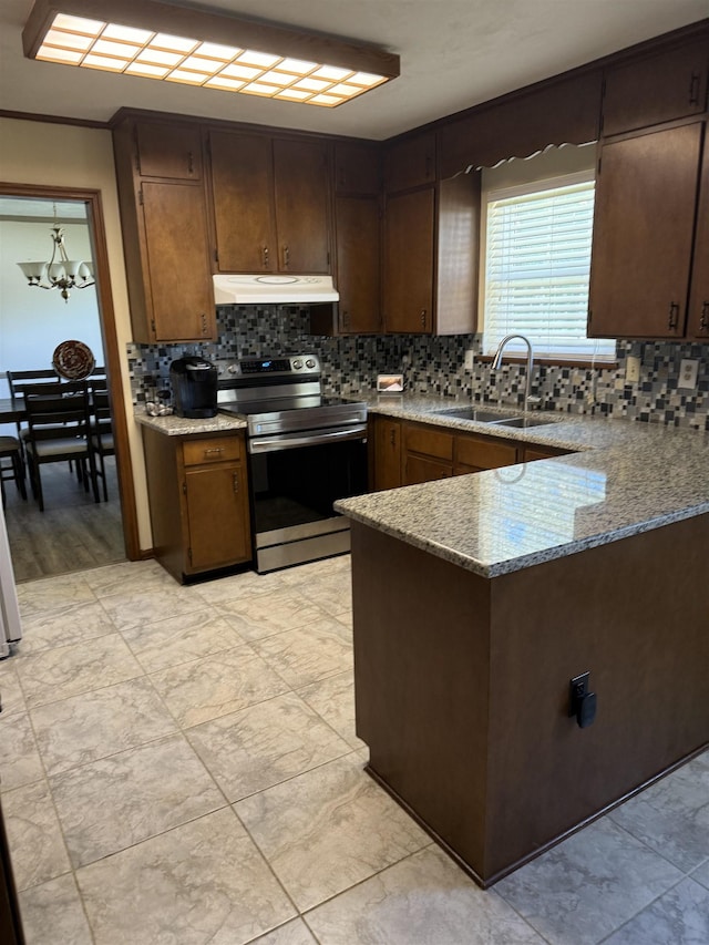 3726 Wicklow Cir, Tallahassee, FL 32309 - kitchen with stainless steel electric stove, tasteful backsplash, and light stone countertops