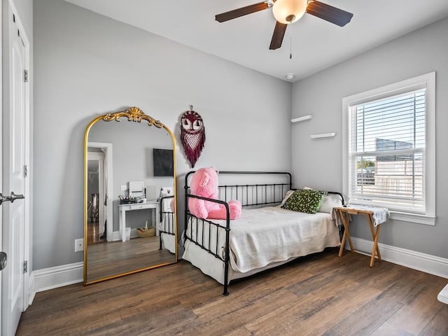 bedroom featuring dark wood-type flooring and ceiling fan