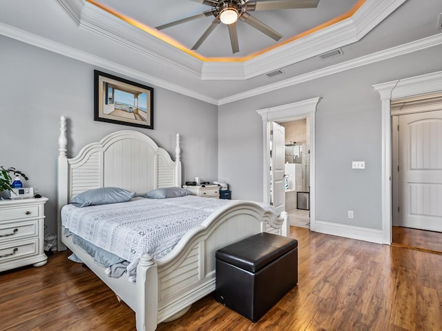 bedroom with ceiling fan, ornamental molding, dark hardwood / wood-style floors, and a raised ceiling