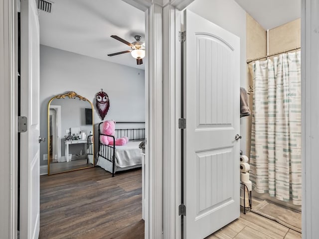 corridor featuring hardwood / wood-style floors