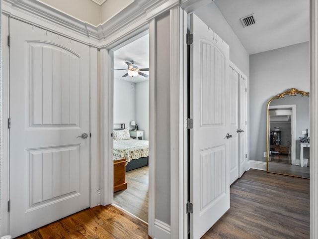 hall with dark hardwood / wood-style flooring