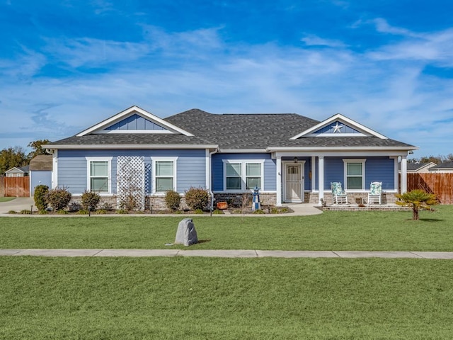 view of front of home with a porch and a front lawn