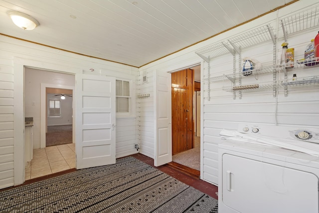 washroom featuring washer / clothes dryer and wood walls