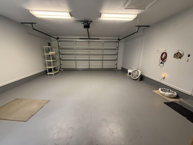601 Judson Dr, Perry, FL 32348 - garage with a garage door opener and baseboards