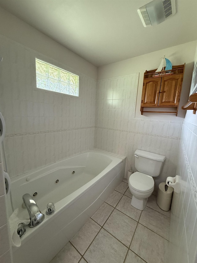 601 Judson Dr, Perry, FL 32348 - full bath with a whirlpool tub, tile patterned flooring, and tile walls