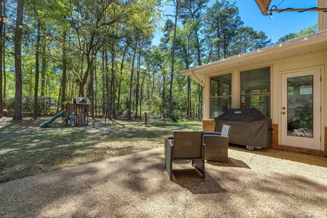 2227 Ten Oaks Dr, Tallahassee, FL 32312 - view of patio featuring a sunroom, area for grilling, and a playground