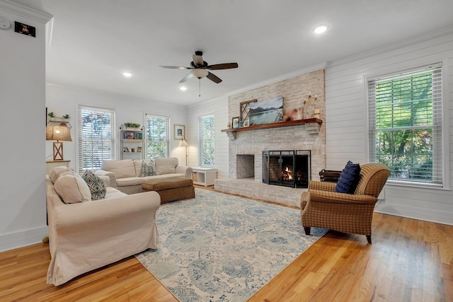 2227 Ten Oaks Dr, Tallahassee, FL 32312 - living room featuring ceiling fan, wood finished floors, a brick fireplace, and ornamental molding