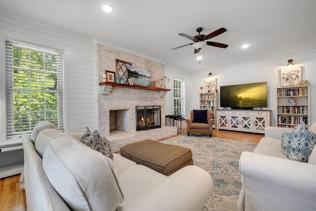 2227 Ten Oaks Dr, Tallahassee, FL 32312 - living area with a ceiling fan, a brick fireplace, plenty of natural light, and wood finished floors