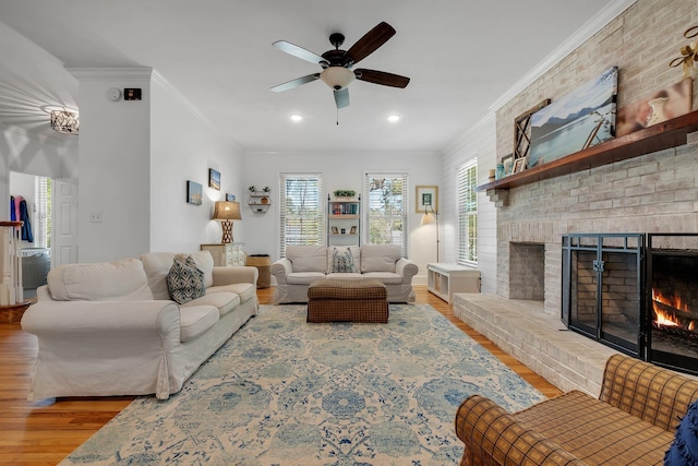 2227 Ten Oaks Dr, Tallahassee, FL 32312 - living area featuring a fireplace, wood finished floors, ceiling fan, and crown molding
