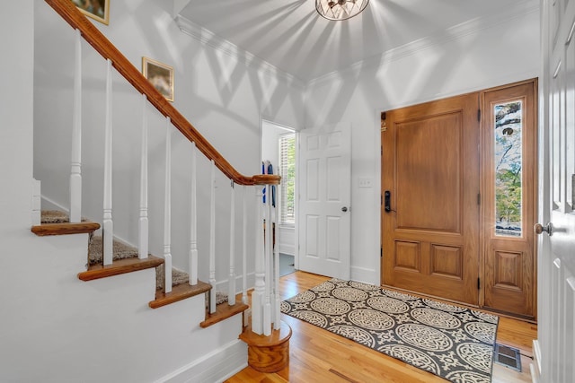 2227 Ten Oaks Dr, Tallahassee, FL 32312 - entryway with visible vents, ornamental molding, stairway, and light wood-type flooring