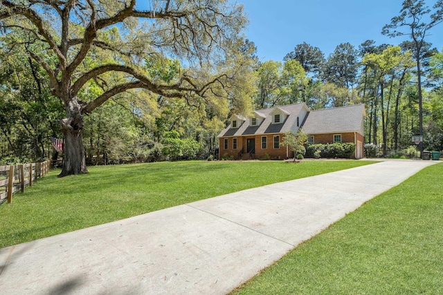 2227 Ten Oaks Dr, Tallahassee, FL 32312 - view of front of house with fence, a front lawn, and concrete driveway