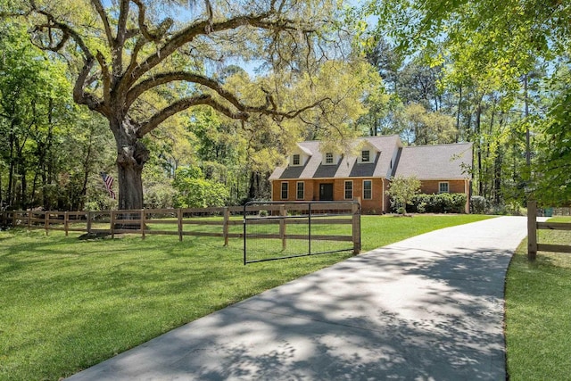 2227 Ten Oaks Dr, Tallahassee, FL 32312 - new england style home featuring a front yard, a fenced front yard, and concrete driveway