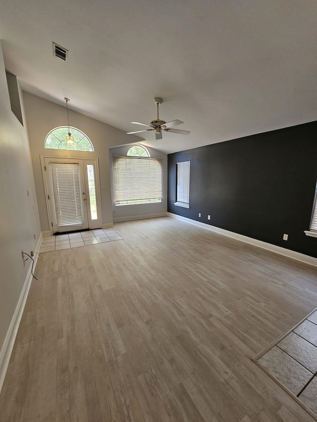 2943 Tewkesbury Trce, Tallahassee, FL 32309 - foyer featuring light wood finished floors, ceiling fan, baseboards, and vaulted ceiling