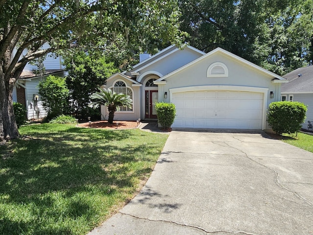 2943 Tewkesbury Trce, Tallahassee, FL 32309 - ranch-style house with concrete driveway, a garage, a front yard, and stucco siding