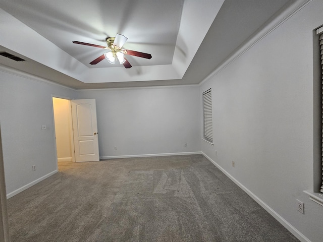 2943 Tewkesbury Trce, Tallahassee, FL 32309 - empty room featuring a raised ceiling, a ceiling fan, carpet flooring, and baseboards