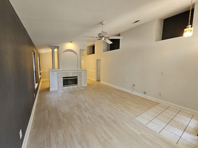 2943 Tewkesbury Trce, Tallahassee, FL 32309 - unfurnished living room featuring ceiling fan, light wood finished floors, baseboards, and lofted ceiling