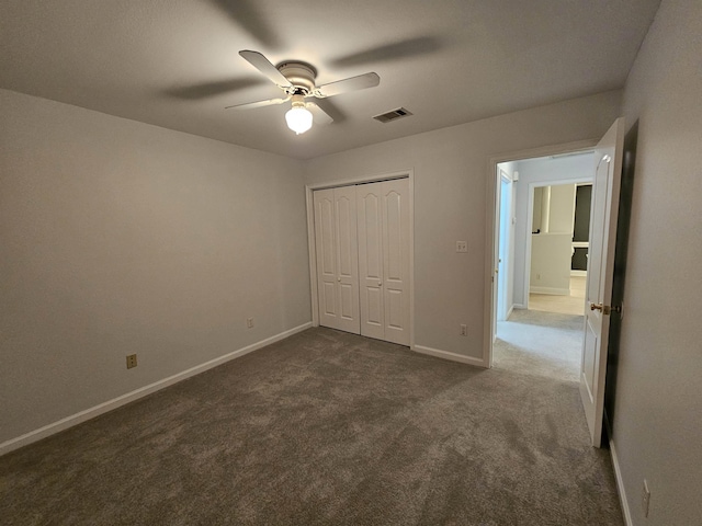 2943 Tewkesbury Trce, Tallahassee, FL 32309 - unfurnished bedroom with dark carpet, a closet, baseboards, and a ceiling fan
