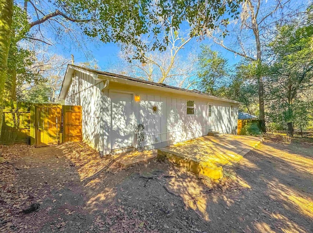 view of home's exterior with a gate