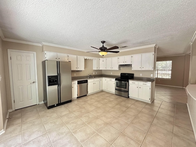 6842 Tomy Lee Trl, Tallahassee, FL 32309 - kitchen featuring appliances with stainless steel finishes, a sink, a textured ceiling, light tile patterned floors, and crown molding