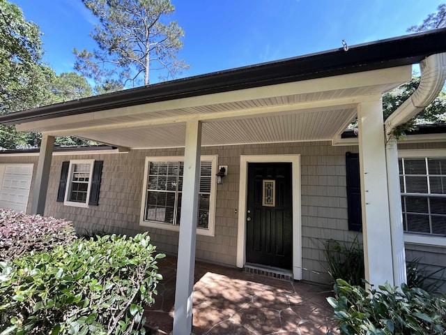 6842 Tomy Lee Trl, Tallahassee, FL 32309 - entrance to property featuring covered porch and an attached garage