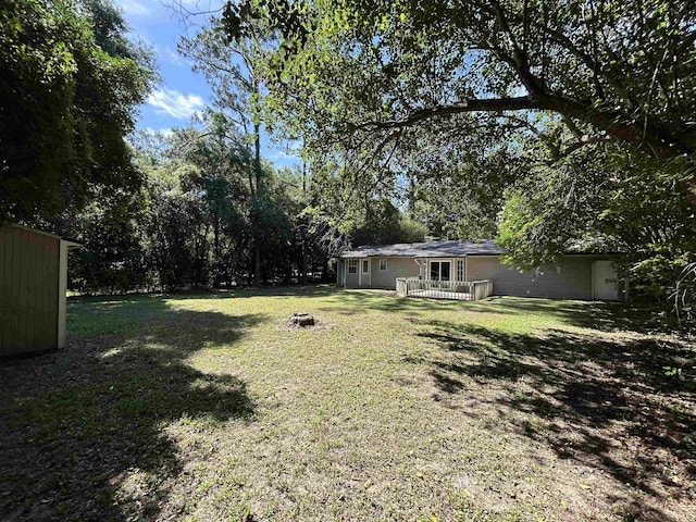 6842 Tomy Lee Trl, Tallahassee, FL 32309 - view of grassy yard with a deck