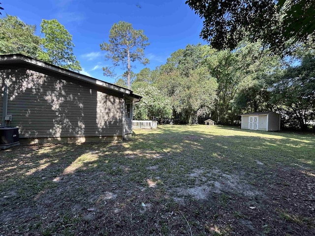 6842 Tomy Lee Trl, Tallahassee, FL 32309 - view of grassy yard with central air condition unit