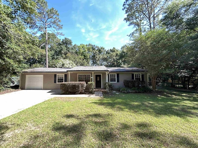 6842 Tomy Lee Trl, Tallahassee, FL 32309 - ranch-style home with a garage, concrete driveway, and a front yard