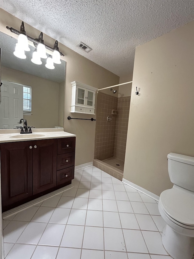 6842 Tomy Lee Trl, Tallahassee, FL 32309 - bathroom with toilet, a shower stall, vanity, a textured ceiling, and baseboards