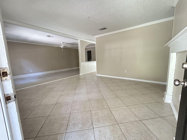 6842 Tomy Lee Trl, Tallahassee, FL 32309 - empty room with a textured ceiling, crown molding, ceiling fan, light tile patterned floors, and baseboards