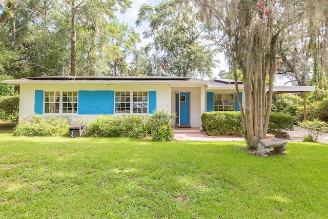 ranch-style house with a front yard