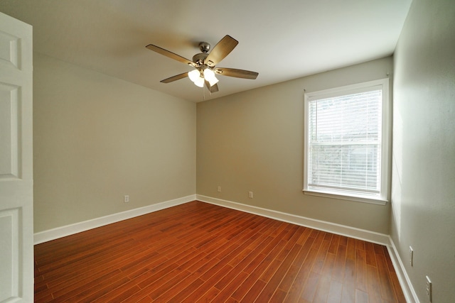 spare room with wood-type flooring and ceiling fan